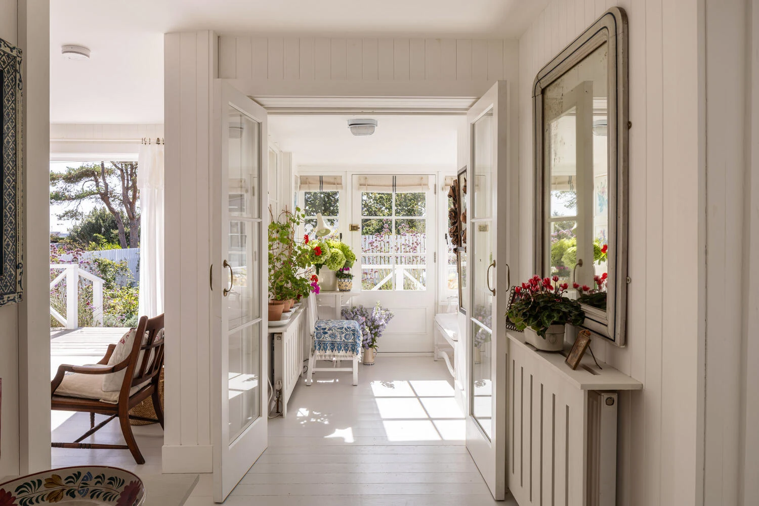 White hallway with a view through the house