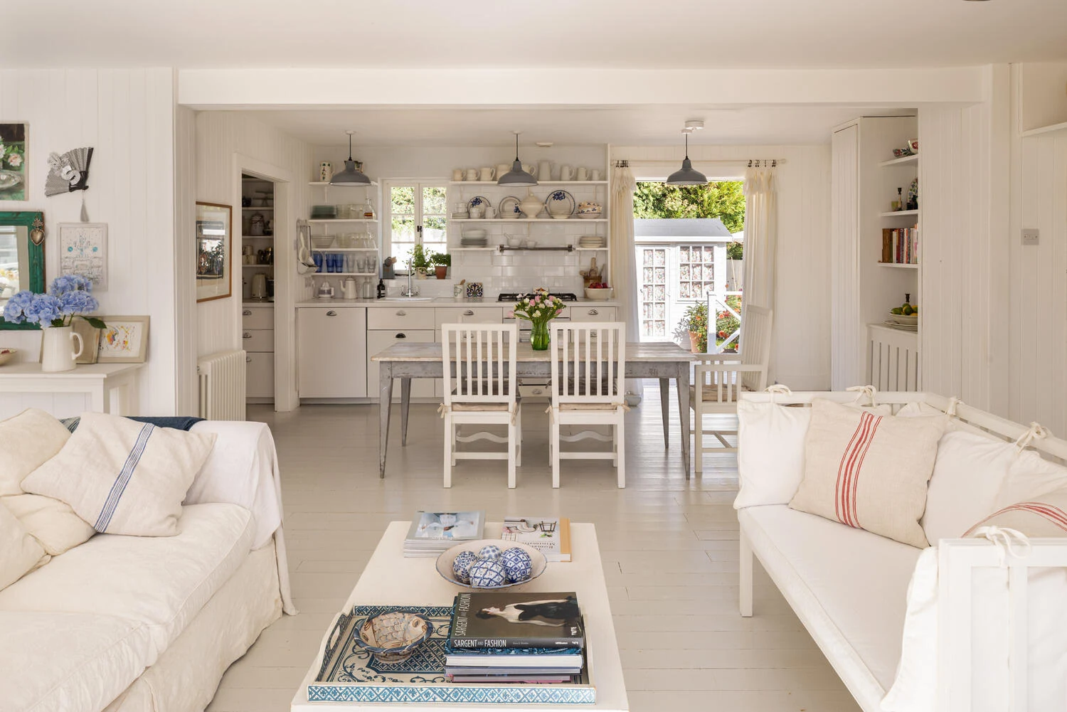 White living and dining spaces